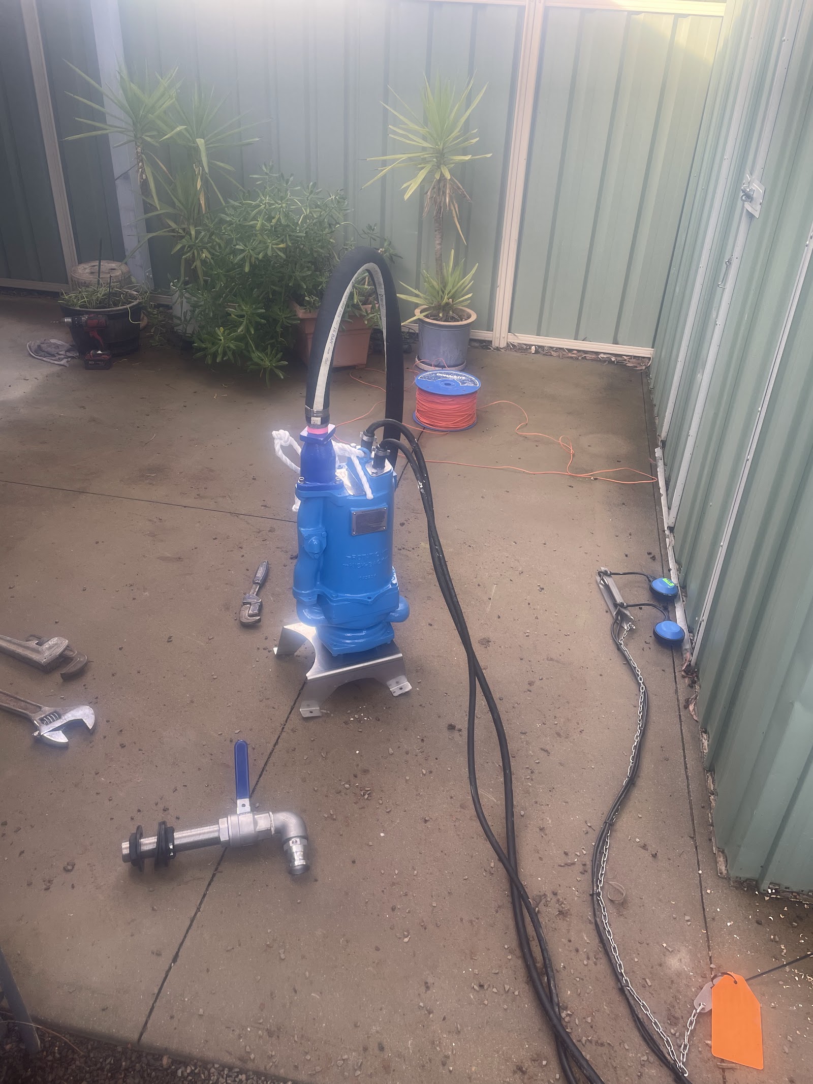 New submersible pump sitting on its base ready to be installed